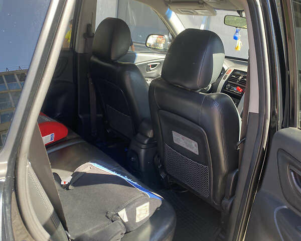 Чорний Хендай Туксон, об'ємом двигуна 1.99 л та пробігом 230 тис. км за 8000 $, фото 5 на Automoto.ua