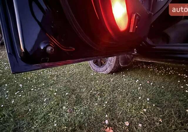 Черный Хендай Туксон, объемом двигателя 1.99 л и пробегом 203 тыс. км за 8000 $, фото 11 на Automoto.ua