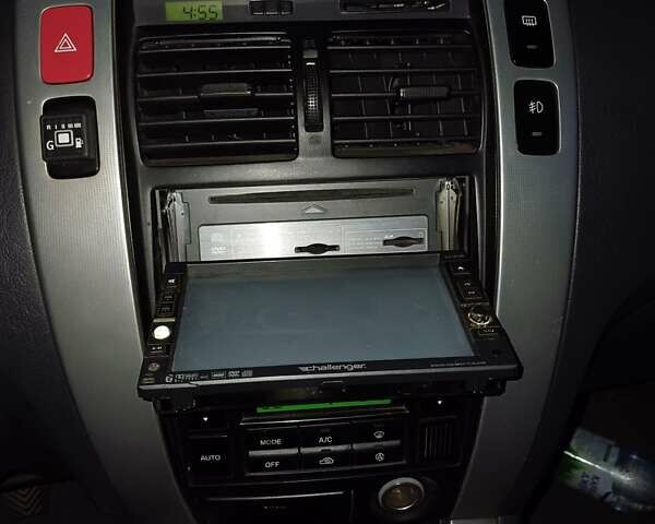 Черный Хендай Туксон, объемом двигателя 1.98 л и пробегом 189 тыс. км за 7800 $, фото 12 на Automoto.ua