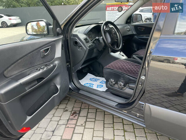 Черный Хендай Туксон, объемом двигателя 1.98 л и пробегом 177 тыс. км за 7600 $, фото 17 на Automoto.ua