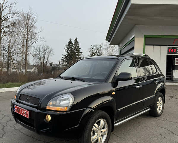 Черный Хендай Туксон, объемом двигателя 2 л и пробегом 210 тыс. км за 7850 $, фото 4 на Automoto.ua
