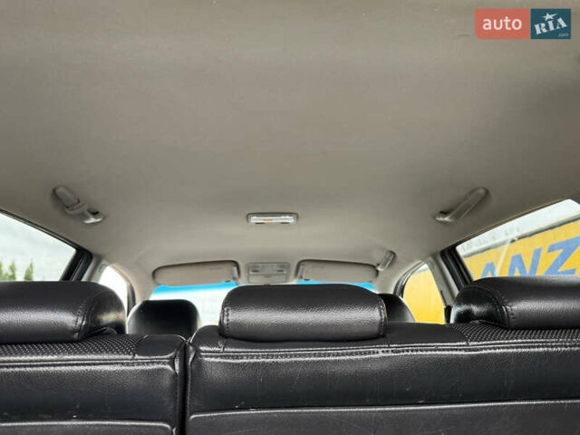 Черный Хендай Туксон, объемом двигателя 1.98 л и пробегом 205 тыс. км за 7950 $, фото 13 на Automoto.ua