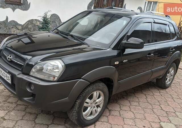 Черный Хендай Туксон, объемом двигателя 2 л и пробегом 163 тыс. км за 8100 $, фото 23 на Automoto.ua