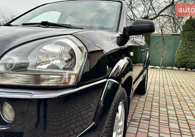 Чорний Хендай Туксон, об'ємом двигуна 2 л та пробігом 182 тис. км за 8299 $, фото 5 на Automoto.ua