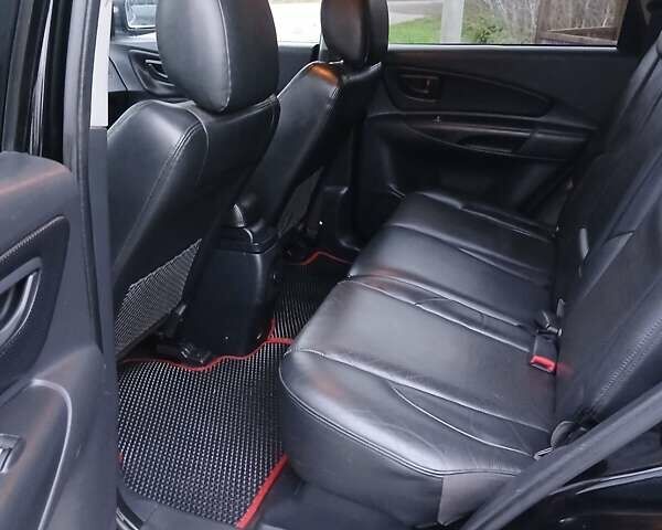 Черный Хендай Туксон, объемом двигателя 2 л и пробегом 230 тыс. км за 8000 $, фото 9 на Automoto.ua
