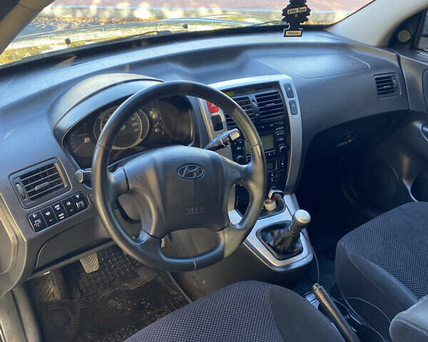 Черный Хендай Туксон, объемом двигателя 1.98 л и пробегом 218 тыс. км за 7200 $, фото 18 на Automoto.ua