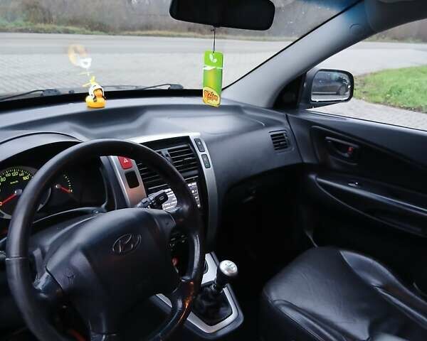 Черный Хендай Туксон, объемом двигателя 2 л и пробегом 230 тыс. км за 8000 $, фото 8 на Automoto.ua