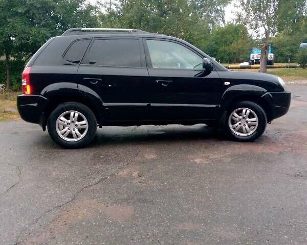 Чорний Хендай Туксон, об'ємом двигуна 2 л та пробігом 225 тис. км за 7850 $, фото 4 на Automoto.ua