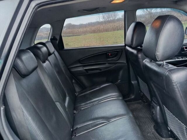 Черный Хендай Туксон, объемом двигателя 2 л и пробегом 276 тыс. км за 8500 $, фото 4 на Automoto.ua