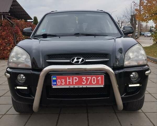 Черный Хендай Туксон, объемом двигателя 1.98 л и пробегом 214 тыс. км за 7700 $, фото 34 на Automoto.ua