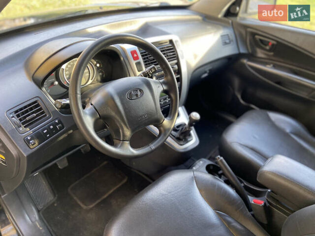 Хендай Туксон 2008 у Рівному на Automoto.ua Чорний Хендай Туксон, об'ємом двигуна 2 л та пробігом 165 тис. км за 7800 $, фото 11 на Automoto.ua