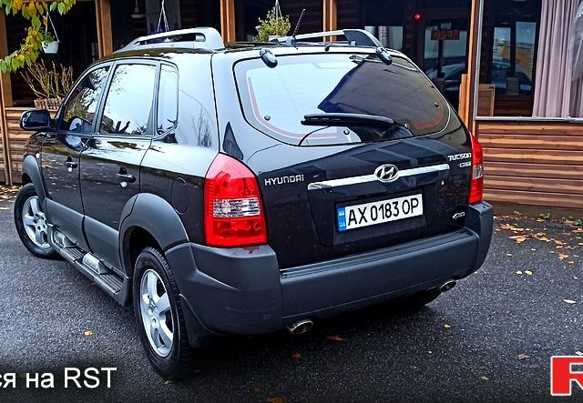 Чорний Хендай Туксон, об'ємом двигуна 2 л та пробігом 188 тис. км за 8800 $, фото 3 на Automoto.ua