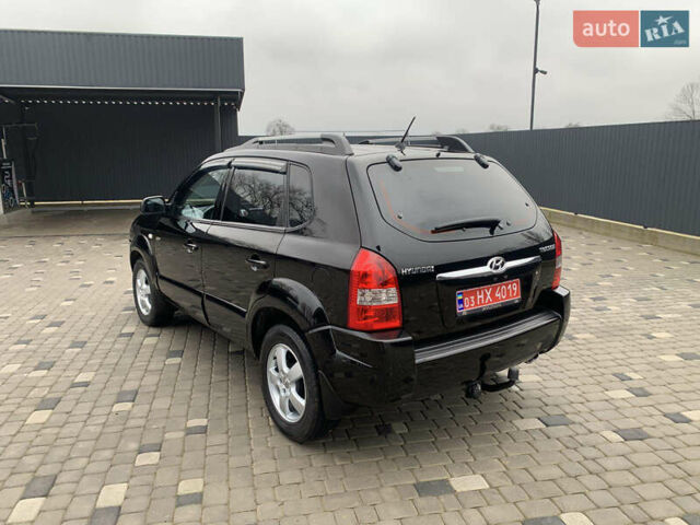 Черный Хендай Туксон, объемом двигателя 2 л и пробегом 198 тыс. км за 7500 $, фото 3 на Automoto.ua