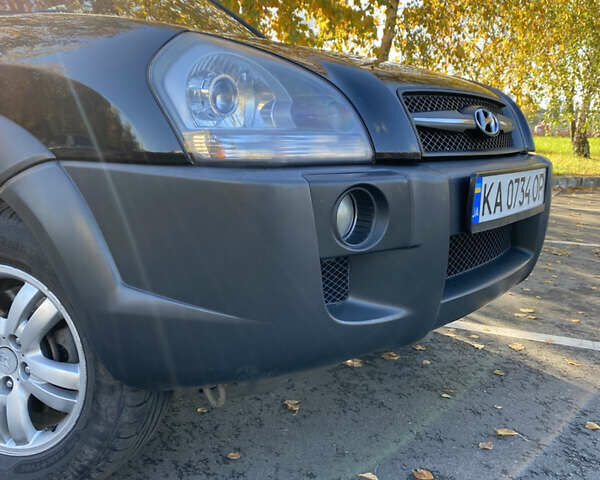 Черный Хендай Туксон, объемом двигателя 1.98 л и пробегом 218 тыс. км за 7200 $, фото 26 на Automoto.ua