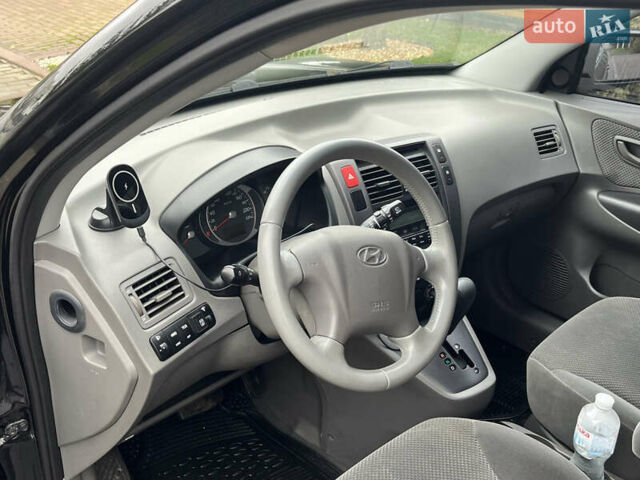 Черный Хендай Туксон, объемом двигателя 2 л и пробегом 107 тыс. км за 8900 $, фото 22 на Automoto.ua
