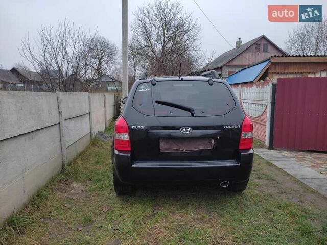 Черный Хендай Туксон, объемом двигателя 2 л и пробегом 237 тыс. км за 7500 $, фото 4 на Automoto.ua
