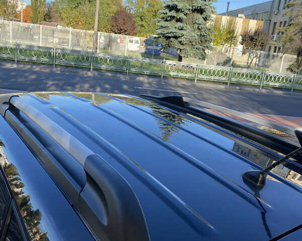 Черный Хендай Туксон, объемом двигателя 1.98 л и пробегом 218 тыс. км за 7200 $, фото 10 на Automoto.ua