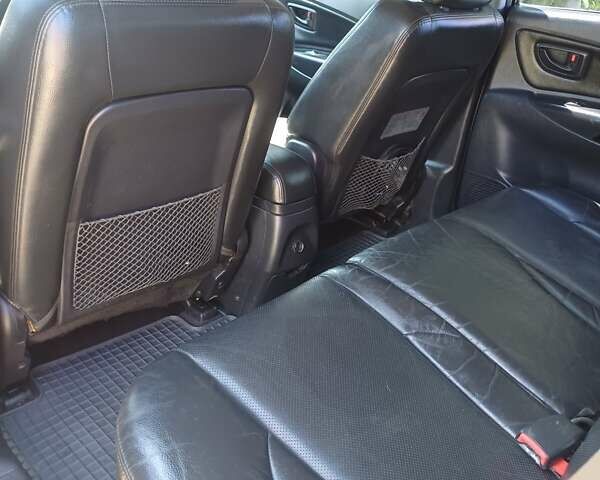 Черный Хендай Туксон, объемом двигателя 1.98 л и пробегом 189 тыс. км за 7800 $, фото 10 на Automoto.ua