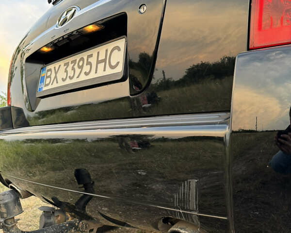 Черный Хендай Туксон, объемом двигателя 2 л и пробегом 323 тыс. км за 9300 $, фото 25 на Automoto.ua