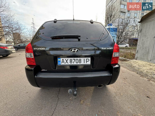Черный Хендай Туксон, объемом двигателя 1.98 л и пробегом 196 тыс. км за 7999 $, фото 6 на Automoto.ua