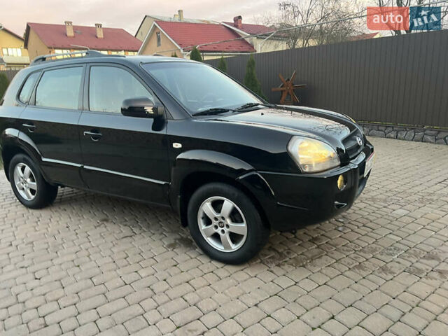 Черный Хендай Туксон, объемом двигателя 2 л и пробегом 276 тыс. км за 7450 $, фото 22 на Automoto.ua