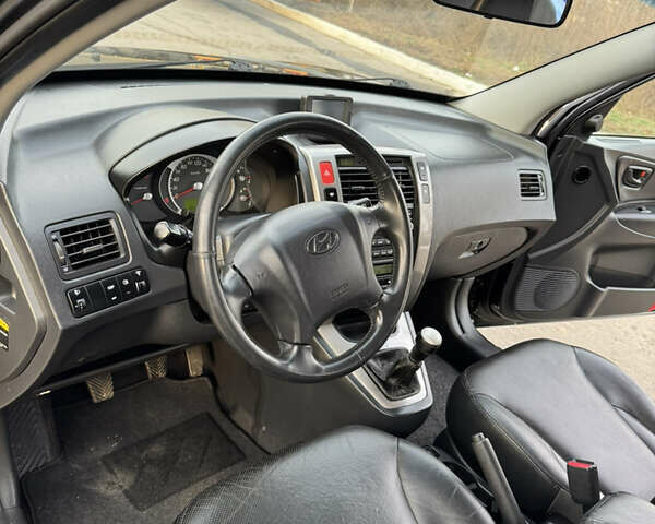 Черный Хендай Туксон, объемом двигателя 2 л и пробегом 210 тыс. км за 7850 $, фото 26 на Automoto.ua