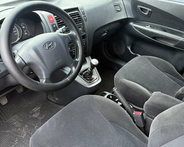 Чорний Хендай Туксон, об'ємом двигуна 2 л та пробігом 240 тис. км за 6888 $, фото 13 на Automoto.ua