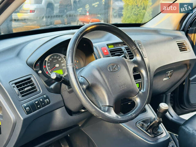 Чорний Хендай Туксон, об'ємом двигуна 2 л та пробігом 186 тис. км за 8300 $, фото 13 на Automoto.ua