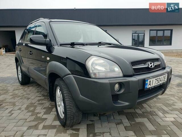 Чорний Хендай Туксон, об'ємом двигуна 2 л та пробігом 225 тис. км за 8000 $, фото 12 на Automoto.ua