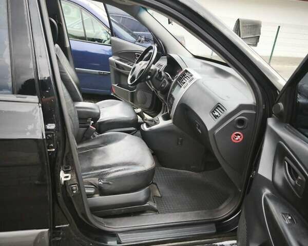 Черный Хендай Туксон, объемом двигателя 1.98 л и пробегом 189 тыс. км за 7800 $, фото 14 на Automoto.ua