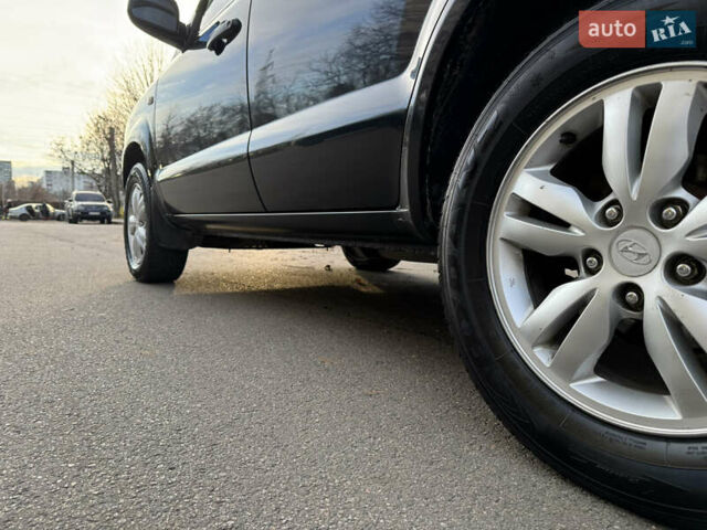 Черный Хендай Туксон, объемом двигателя 1.98 л и пробегом 196 тыс. км за 7999 $, фото 20 на Automoto.ua