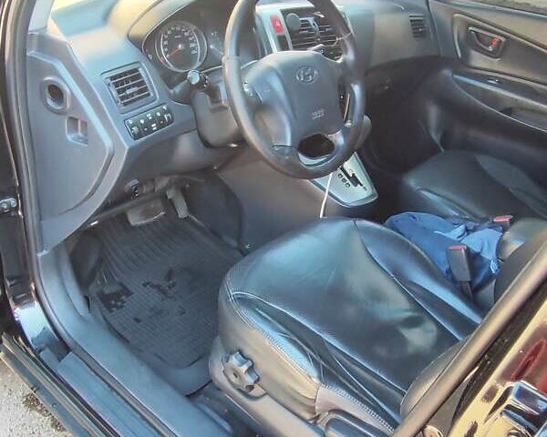 Черный Хендай Туксон, объемом двигателя 1.98 л и пробегом 330 тыс. км за 8200 $, фото 4 на Automoto.ua