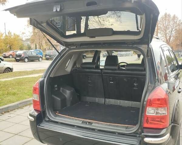 Черный Хендай Туксон, объемом двигателя 1.98 л и пробегом 214 тыс. км за 7700 $, фото 12 на Automoto.ua