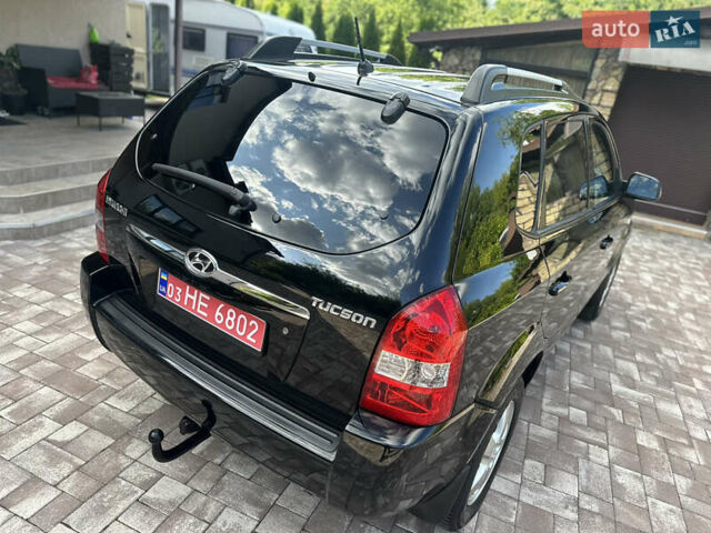 Черный Хендай Туксон, объемом двигателя 2 л и пробегом 218 тыс. км за 8700 $, фото 13 на Automoto.ua