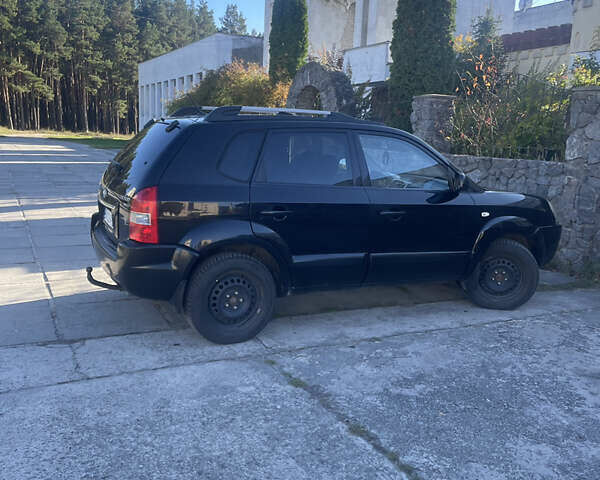 Черный Хендай Туксон, объемом двигателя 1.98 л и пробегом 262 тыс. км за 7900 $, фото 7 на Automoto.ua