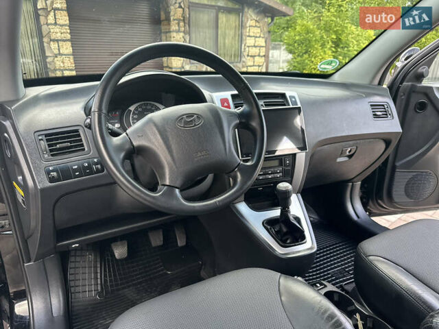 Черный Хендай Туксон, объемом двигателя 2 л и пробегом 218 тыс. км за 8700 $, фото 23 на Automoto.ua