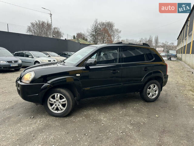 Чорний Хендай Туксон, об'ємом двигуна 2 л та пробігом 243 тис. км за 7999 $, фото 7 на Automoto.ua