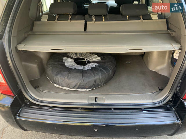 Черный Хендай Туксон, объемом двигателя 1.98 л и пробегом 260 тыс. км за 7777 $, фото 14 на Automoto.ua