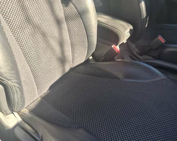 Черный Хендай Туксон, объемом двигателя 1.98 л и пробегом 93 тыс. км за 11800 $, фото 7 на Automoto.ua