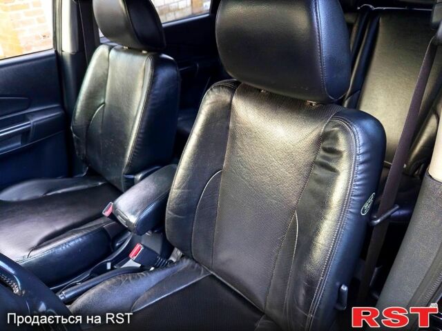 Черный Хендай Туксон, объемом двигателя 2 л и пробегом 187 тыс. км за 7900 $, фото 7 на Automoto.ua