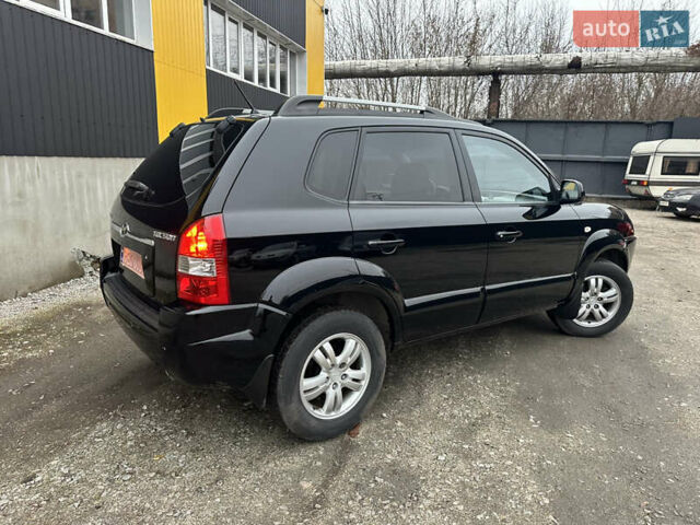 Чорний Хендай Туксон, об'ємом двигуна 2 л та пробігом 243 тис. км за 7999 $, фото 20 на Automoto.ua