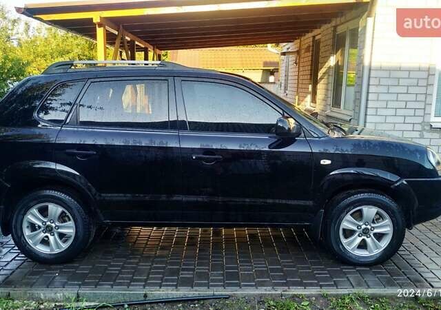 Чорний Хендай Туксон, об'ємом двигуна 2 л та пробігом 148 тис. км за 9200 $, фото 5 на Automoto.ua