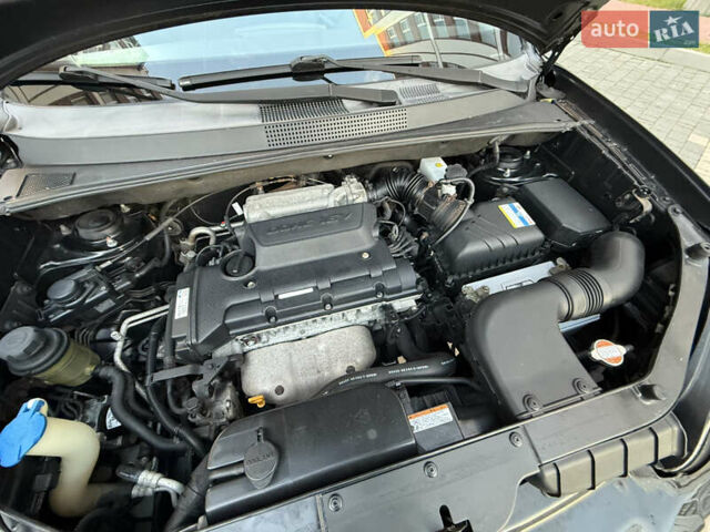 Чорний Хендай Туксон, об'ємом двигуна 2 л та пробігом 156 тис. км за 7850 $, фото 59 на Automoto.ua