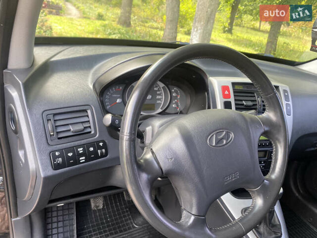 Чорний Хендай Туксон, об'ємом двигуна 2 л та пробігом 160 тис. км за 8800 $, фото 10 на Automoto.ua