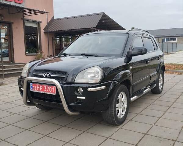 Черный Хендай Туксон, объемом двигателя 1.98 л и пробегом 214 тыс. км за 7700 $, фото 1 на Automoto.ua
