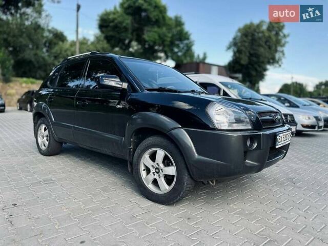 Черный Хендай Туксон, объемом двигателя 1.98 л и пробегом 206 тыс. км за 8300 $, фото 14 на Automoto.ua