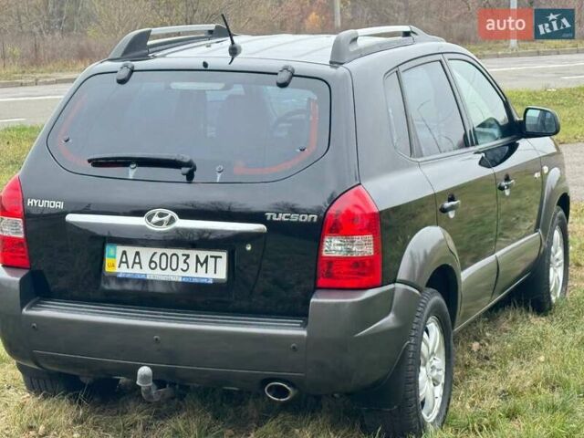 Черный Хендай Туксон, объемом двигателя 2 л и пробегом 148 тыс. км за 9500 $, фото 5 на Automoto.ua