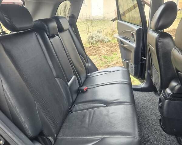 Чорний Хендай Туксон, об'ємом двигуна 1.99 л та пробігом 181 тис. км за 8150 $, фото 6 на Automoto.ua