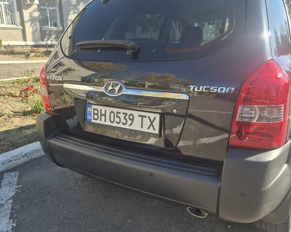 Черный Хендай Туксон, объемом двигателя 1.98 л и пробегом 93 тыс. км за 11800 $, фото 8 на Automoto.ua