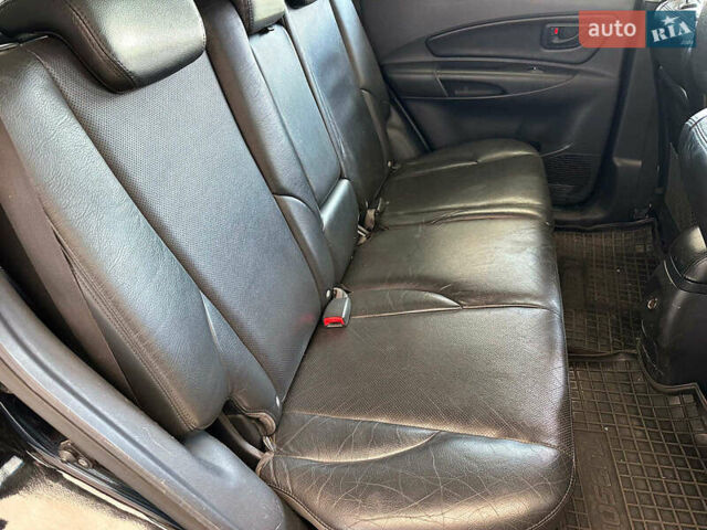 Черный Хендай Туксон, объемом двигателя 2.7 л и пробегом 158 тыс. км за 7940 $, фото 14 на Automoto.ua